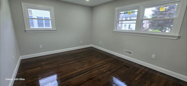 151 Boylston St, Hempstead, NY 11550 - empty room with dark wood-style floors and baseboards