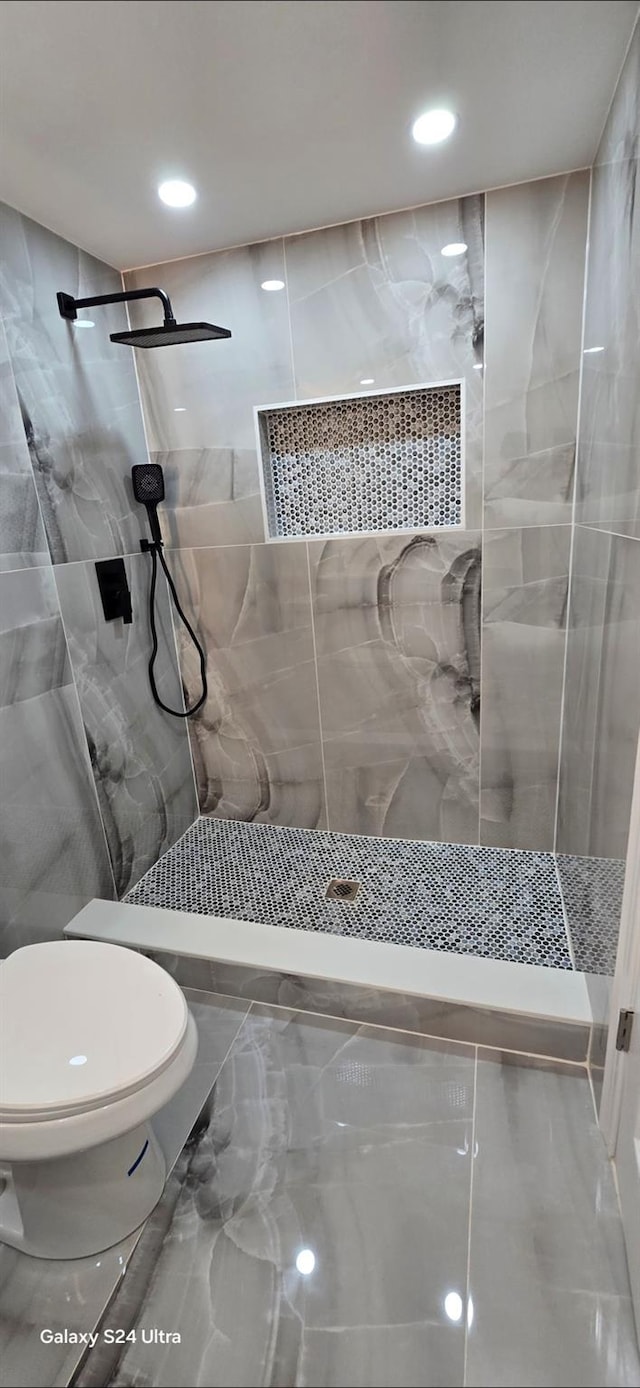 151 Boylston St, Hempstead, NY 11550 - full bathroom featuring toilet, a tile shower, and recessed lighting