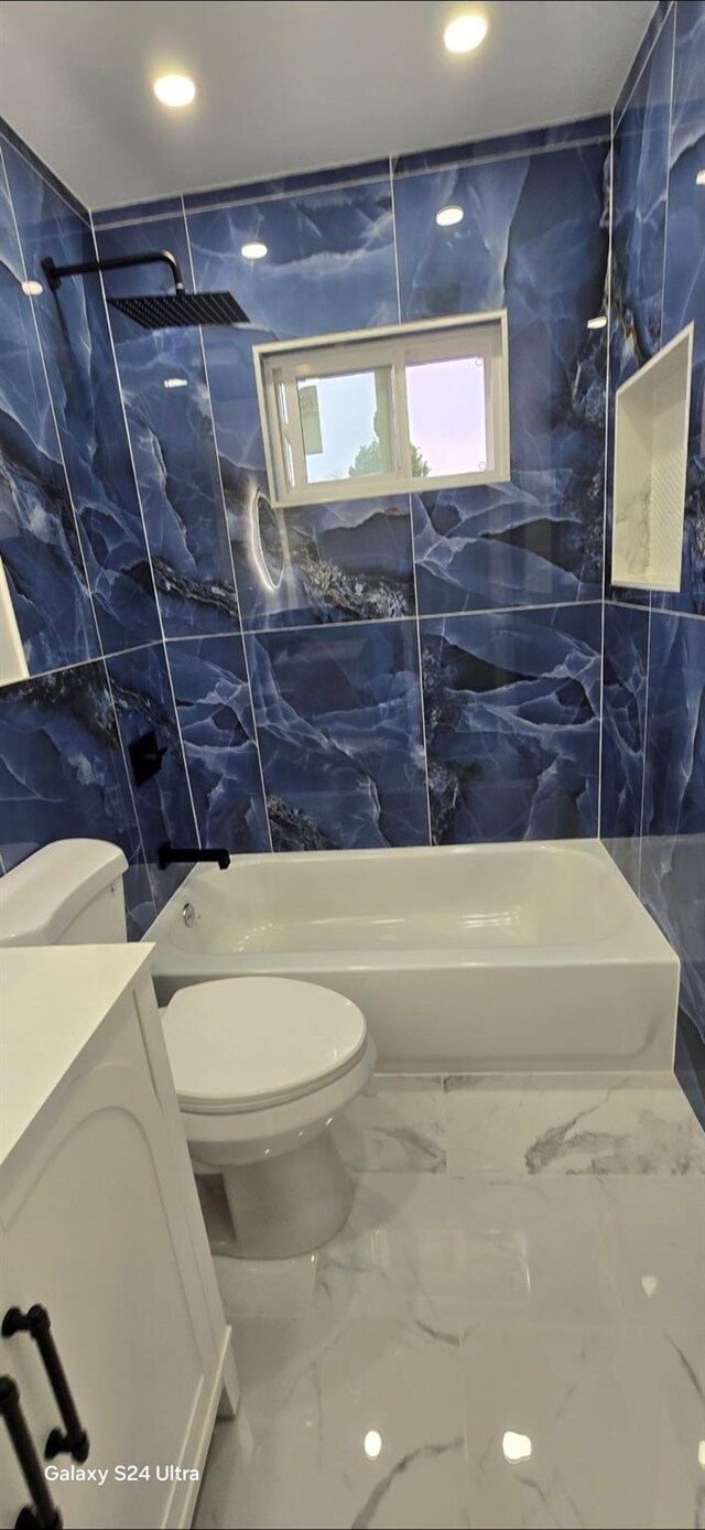 151 Boylston St, Hempstead, NY 11550 - bathroom with tile walls, toilet, recessed lighting, marble finish floors, and bathing tub / shower combination