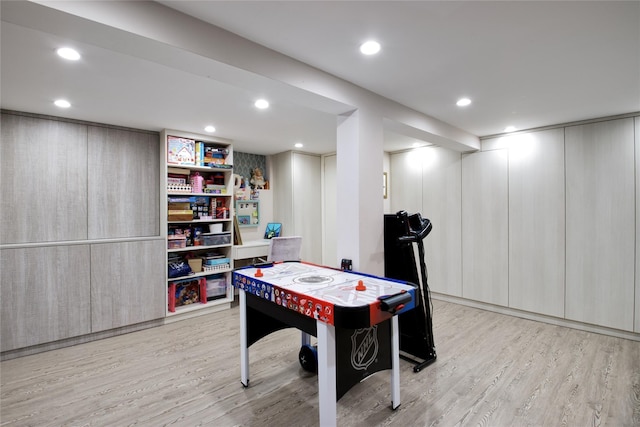 playroom with light wood finished floors and recessed lighting