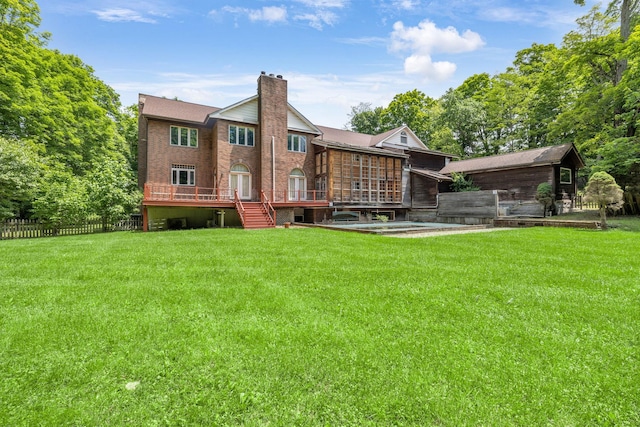 3893 Rte 82, Millbrook, NY 12545 - back of property with a wooden deck and a chimney