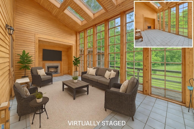 3893 Rte 82, Millbrook, NY 12545 - sunroom / solarium with wooden walls, high vaulted ceiling, tile patterned floors, a skylight, and wood ceiling