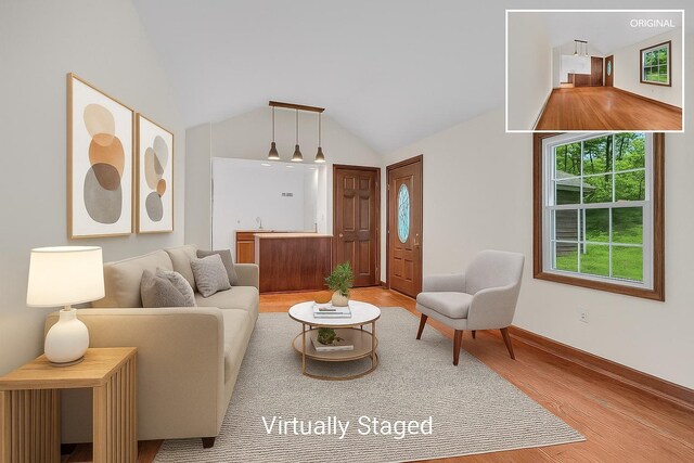 3893 Rte 82, Millbrook, NY 12545 - living room with wood finished floors, vaulted ceiling, and baseboards