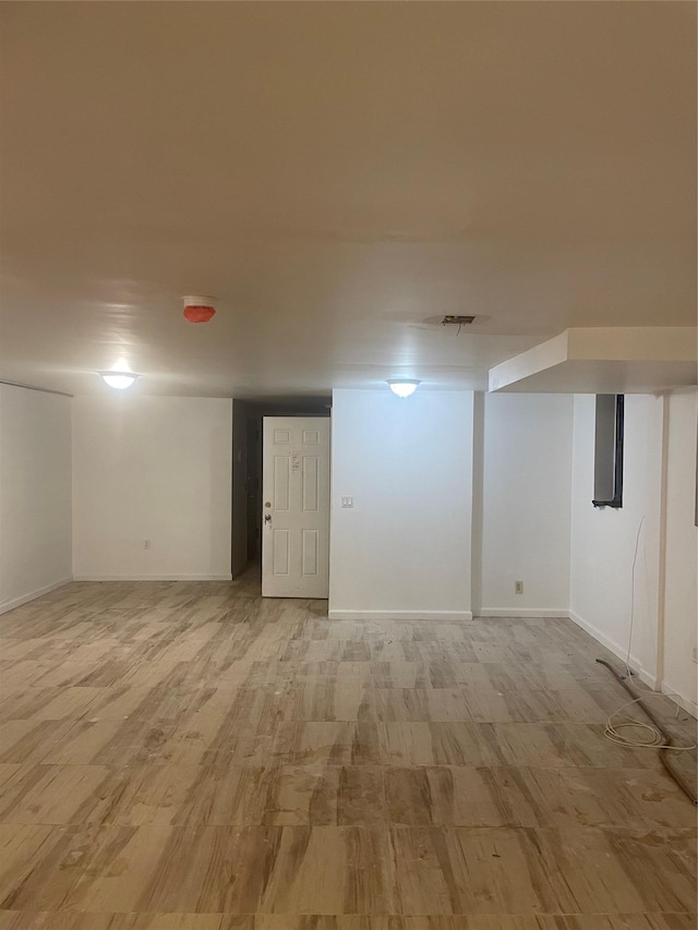 3418 Irwin Ave, Bronx, NY 10463 - finished basement featuring light wood-style floors and baseboards