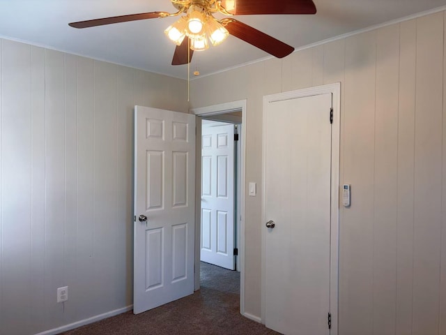 2333 Beech St, Wantagh, NY 11793 - unfurnished bedroom with dark colored carpet, ceiling fan, and crown molding