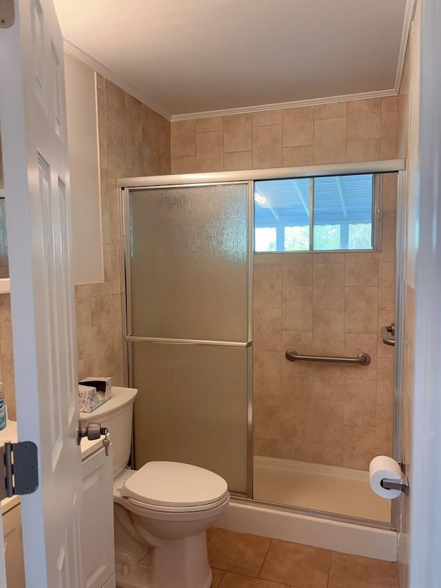 2333 Beech St, Wantagh, NY 11793 - full bath with tile patterned floors, a stall shower, toilet, tile walls, and crown molding