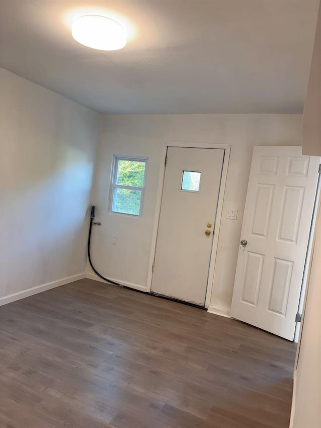 2333 Beech St, Wantagh, NY 11793 - foyer with dark wood-type flooring and baseboards