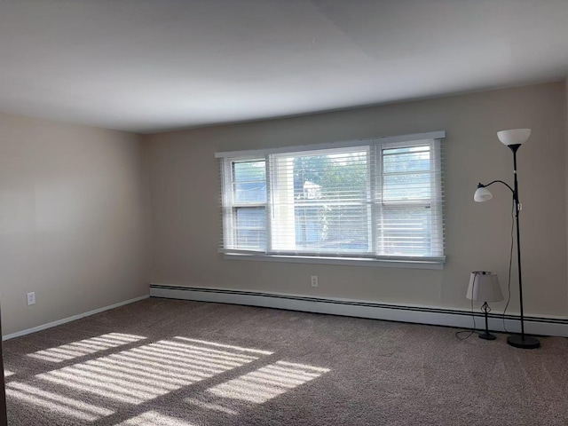 2333 Beech St, Wantagh, NY 11793 - carpeted empty room with baseboards and a baseboard radiator