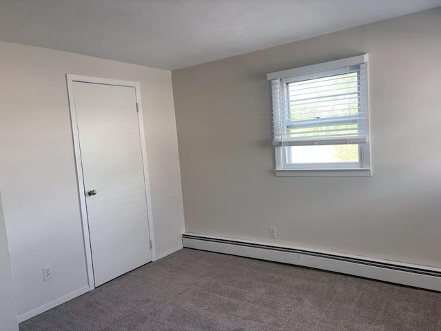 2333 Beech St, Wantagh, NY 11793 - carpeted spare room featuring a baseboard radiator