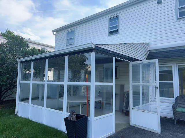 2333 Beech St, Wantagh, NY 11793 - view of home's exterior featuring a sunroom