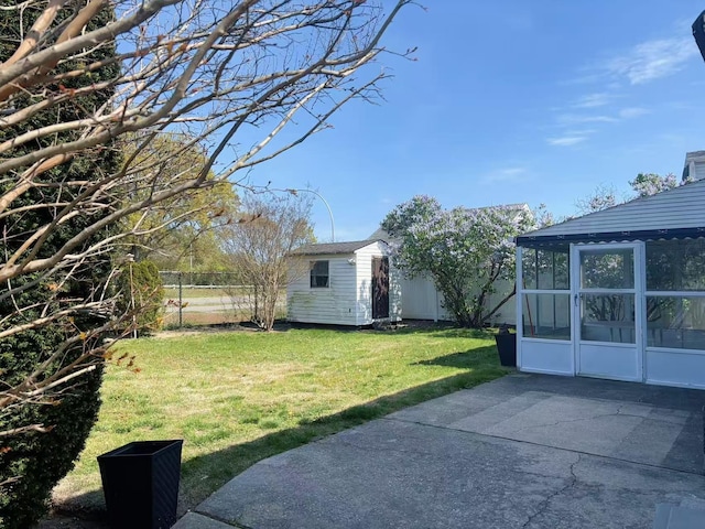 2333 Beech St, Wantagh, NY 11793 - view of yard with a sunroom, a patio, an outbuilding, and a shed