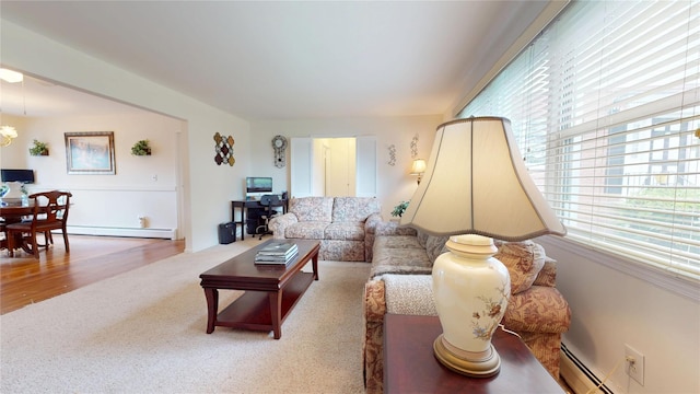 10 Lenox Ct Unit 806, Suffern, NY 10901 - carpeted living area featuring a baseboard heating unit and a baseboard radiator