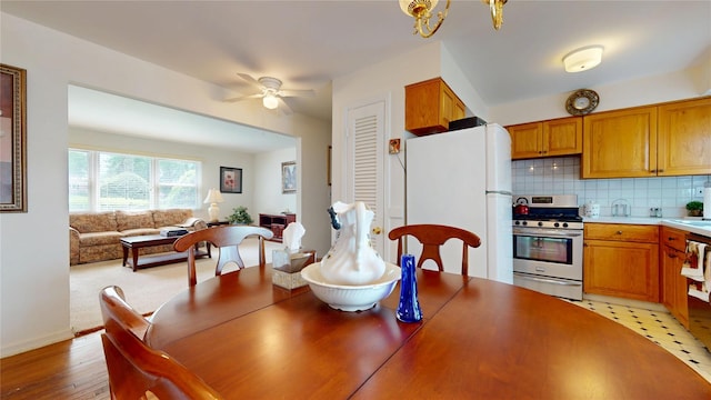 10 Lenox Ct Unit 806, Suffern, NY 10901 - dining room with a ceiling fan, light wood-style floors, and baseboards