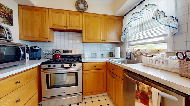 10 Lenox Ct Unit 806, Suffern, NY 10901 - kitchen featuring stainless steel appliances, a sink, light countertops, decorative backsplash, and light flooring