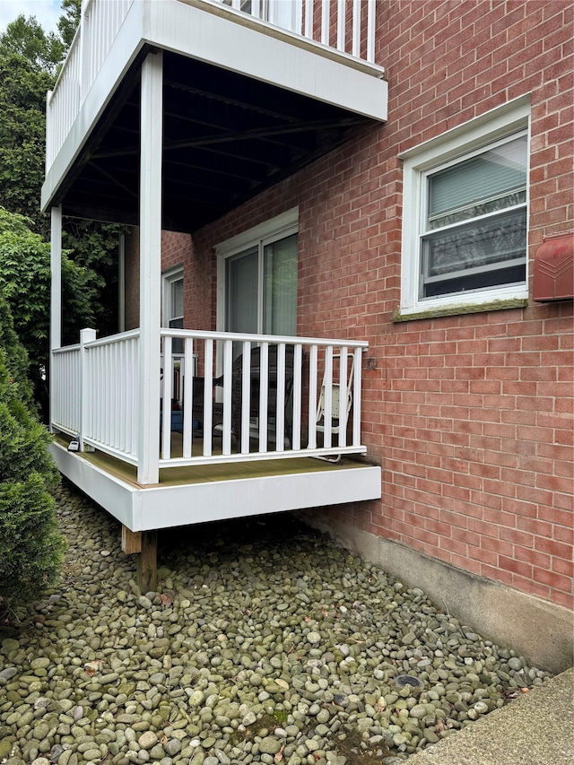 10 Lenox Ct Unit 806, Suffern, NY 10901 - view of side of home with brick siding and a wooden deck