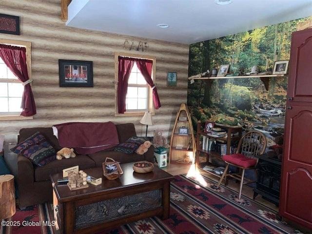 981 New Hague Rd, Call Listing Agent, NY 12836 - living room with log walls