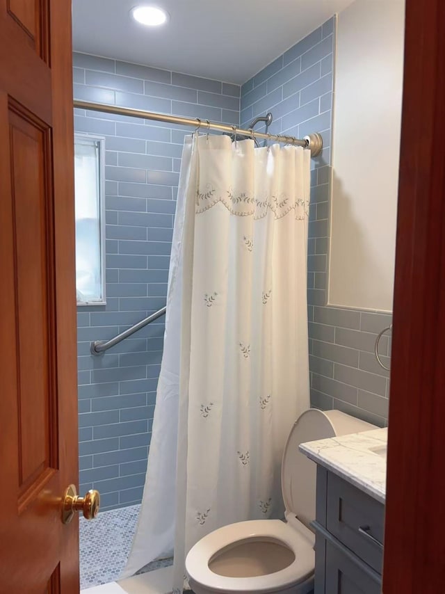 2090 Post St, East Meadow, NY 11554 - full bath featuring tile walls, tiled shower, toilet, and vanity