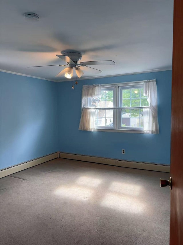 2090 Post St, East Meadow, NY 11554 - carpeted empty room with a smoke detector, a ceiling fan, crown molding, and baseboards