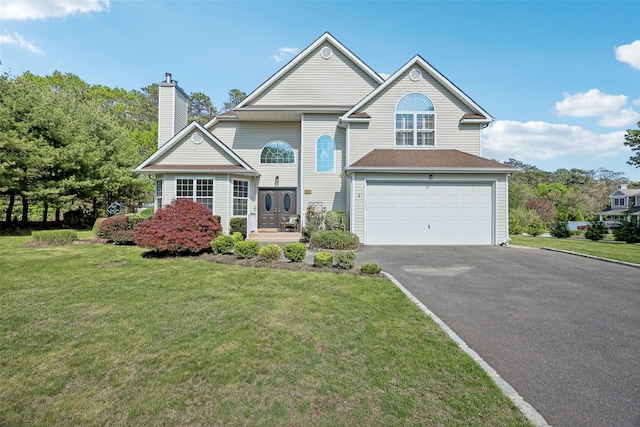 20 Mercer St, Port Jefferson Station, NY 11776 - traditional home with asphalt driveway, a garage, a chimney, and a front lawn