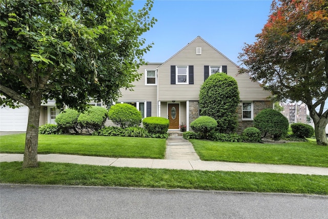 287 Harrison Ave, Harrison, NY 10528 - view of front of home featuring stone siding and a front lawn