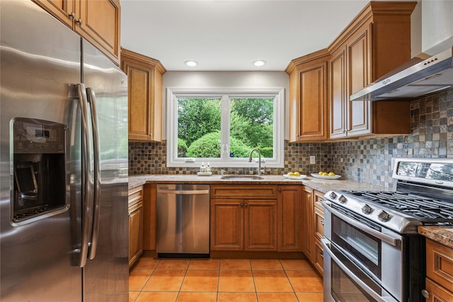 287 Harrison Ave, Harrison, NY 10528 - kitchen featuring stainless steel appliances, wall chimney range hood, and brown cabinets