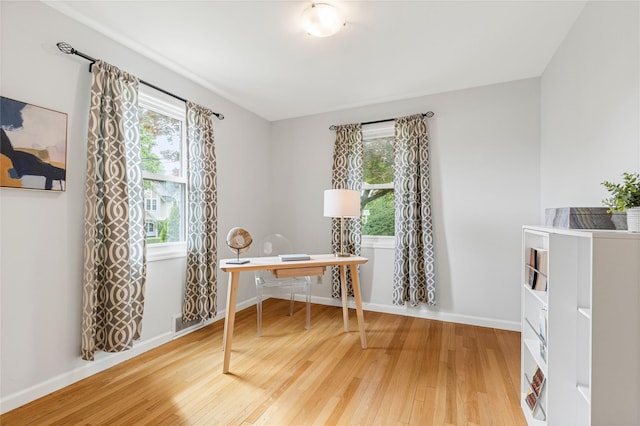 287 Harrison Ave, Harrison, NY 10528 - home office featuring hardwood / wood-style floors and plenty of natural light