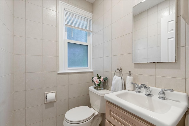 287 Harrison Ave, Harrison, NY 10528 - bathroom with tile walls, vanity, and tasteful backsplash