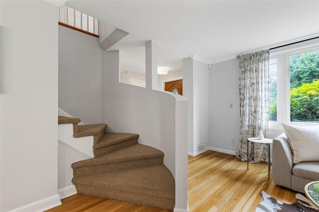 287 Harrison Ave, Harrison, NY 10528 - staircase with wood finished floors and ornamental molding