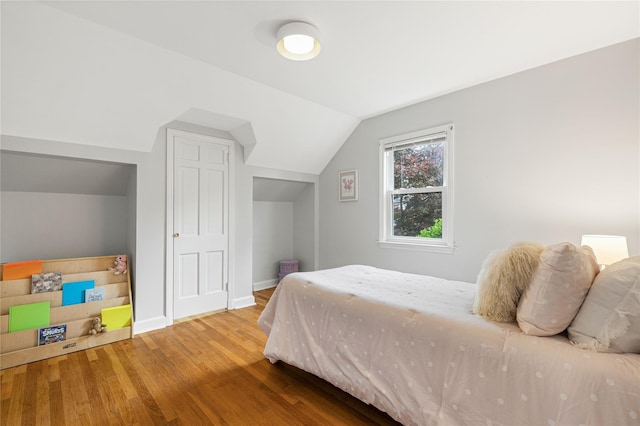 287 Harrison Ave, Harrison, NY 10528 - bedroom featuring wood finished floors and vaulted ceiling