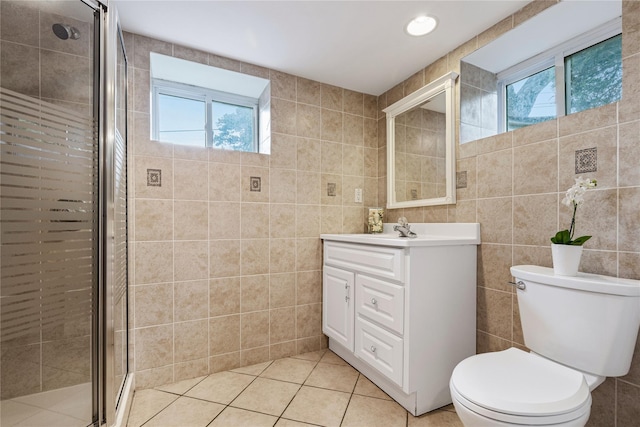287 Harrison Ave, Harrison, NY 10528 - full bathroom featuring tile walls, healthy amount of natural light, vanity, and a stall shower