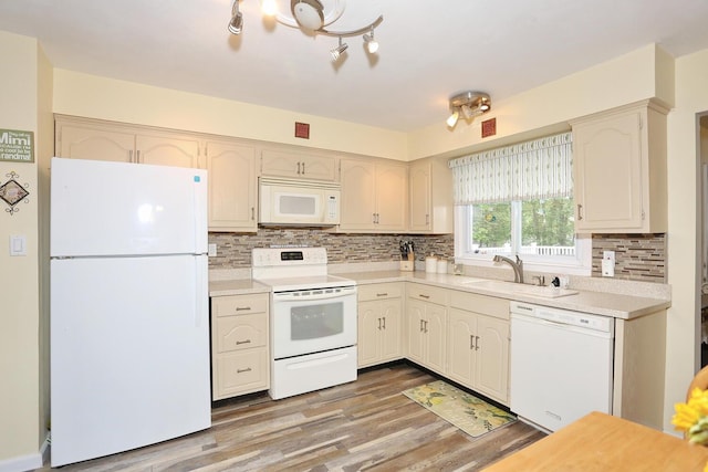 29 Park Ter, Valley Cottage, NY 10989 - kitchen with white appliances, a sink, backsplash, light wood finished floors, and light countertops