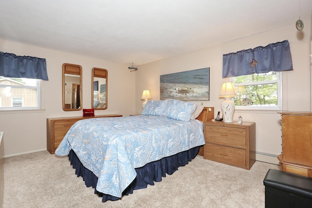29 Park Ter, Valley Cottage, NY 10989 - bedroom with multiple windows, carpet flooring, a baseboard heating unit, and baseboards