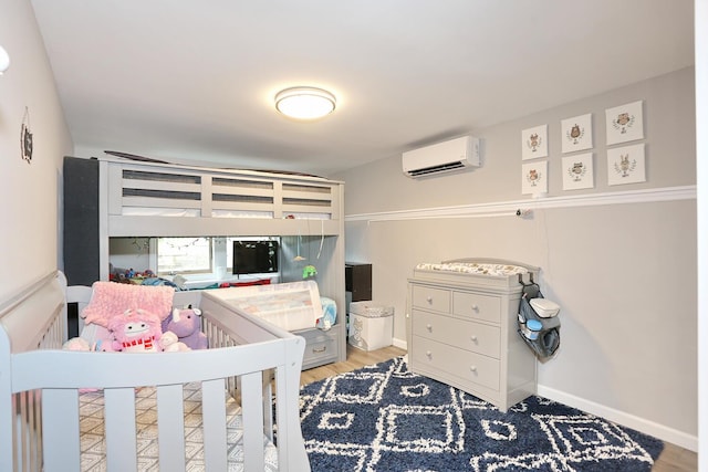 29 Park Ter, Valley Cottage, NY 10989 - bedroom with an AC wall unit, wood finished floors, and baseboards