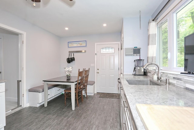 29 Park Ter, Valley Cottage, NY 10989 - kitchen with a sink, dark wood-style flooring, white cabinetry, recessed lighting, and light stone countertops