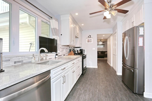 29 Park Ter, Valley Cottage, NY 10989 - kitchen with appliances with stainless steel finishes, ceiling fan, a sink, tasteful backsplash, and recessed lighting