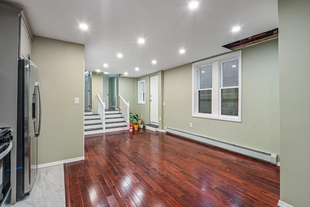 107-30 156th St, Jamaica, NY 11433 - unfurnished living room featuring a baseboard radiator, light wood-style flooring, stairway, recessed lighting, and baseboards
