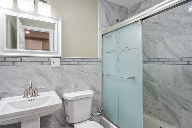 107-30 156th St, Jamaica, NY 11433 - full bath with a sink, toilet, bath / shower combo with glass door, and tile walls