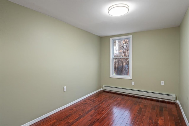 107-30 156th St, Jamaica, NY 11433 - unfurnished room featuring a baseboard radiator, dark wood-style floors, and baseboards