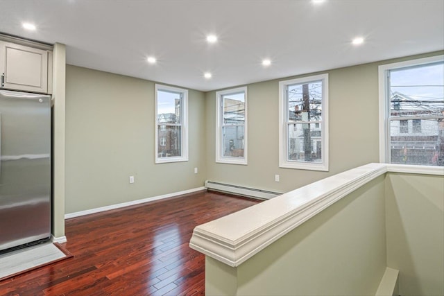 107-30 156th St, Jamaica, NY 11433 - interior space with baseboard heating, dark wood finished floors, recessed lighting, and baseboards