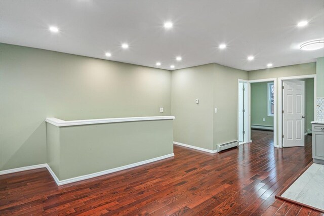 107-30 156th St, Jamaica, NY 11433 - empty room with a baseboard radiator, dark wood-type flooring, baseboards, and recessed lighting