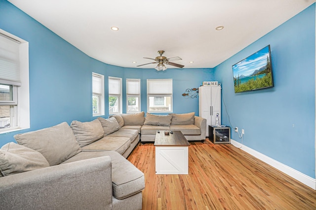 living area featuring baseboards, light wood-style floors, recessed lighting, and ceiling fan