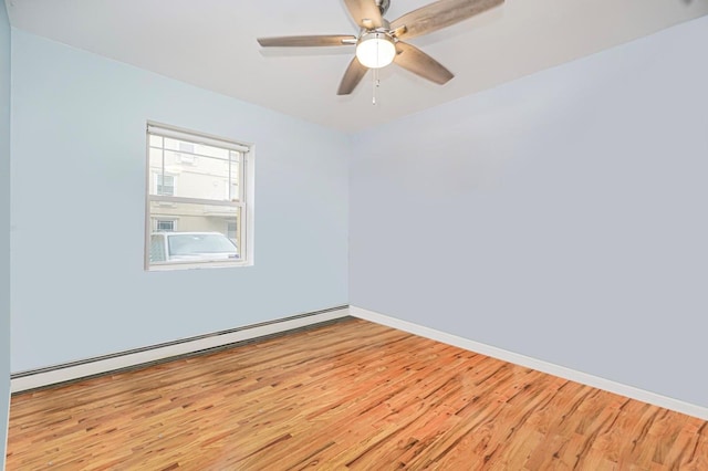 unfurnished room featuring baseboard heating, light wood-style flooring, baseboards, and ceiling fan