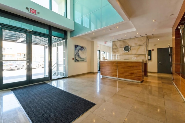 260 W Broadway Unit 2B, Long Beach, NY 11561 - welcome area featuring french doors and a towering ceiling