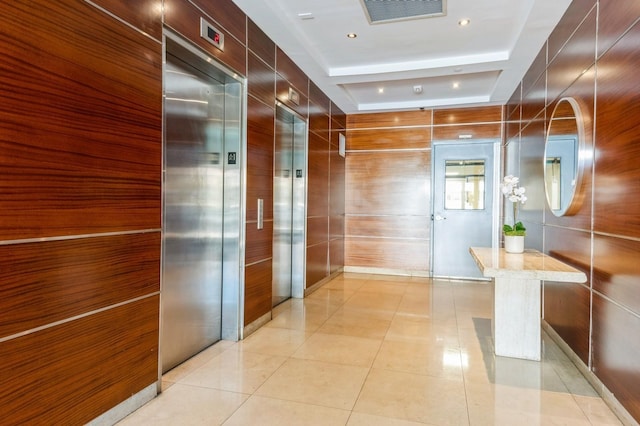 260 W Broadway Unit 2B, Long Beach, NY 11561 - corridor with elevator, a raised ceiling, and light tile patterned flooring