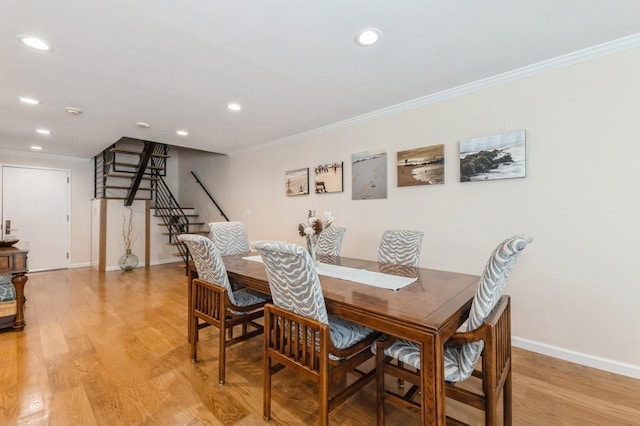 260 W Broadway Unit 2B, Long Beach, NY 11561 - dining area featuring crown molding, stairway, recessed lighting, baseboards, and light wood-style floors