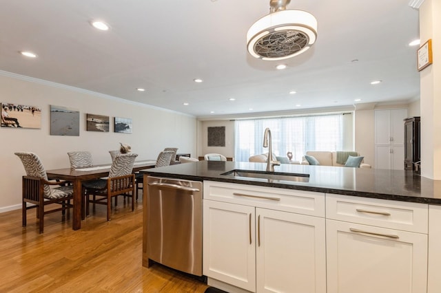 260 W Broadway Unit 2B, Long Beach, NY 11561 - kitchen with stainless steel dishwasher, a sink, ornamental molding, white cabinets, and light wood-style floors