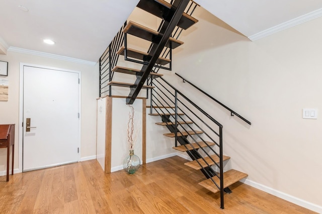 260 W Broadway Unit 2B, Long Beach, NY 11561 - stairs featuring ornamental molding, wood finished floors, and baseboards