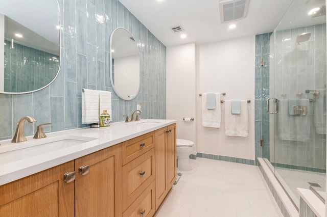 260 W Broadway Unit 2B, Long Beach, NY 11561 - bathroom with a stall shower, tile patterned floors, tile walls, double vanity, and toilet