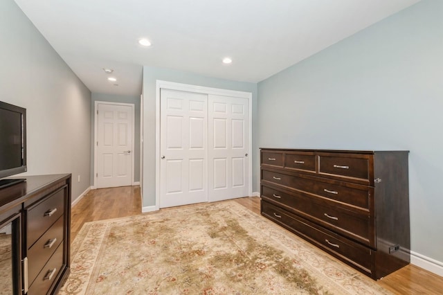 260 W Broadway Unit 2B, Long Beach, NY 11561 - bedroom with light wood-style flooring, a closet, baseboards, and recessed lighting