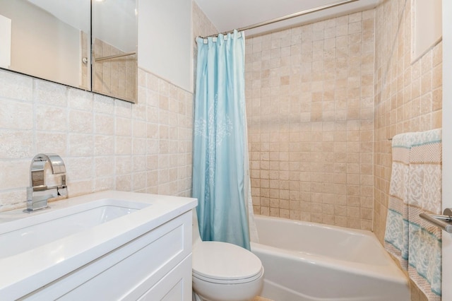 260 W Broadway Unit 2B, Long Beach, NY 11561 - full bathroom featuring tile walls, shower / tub combo with curtain, toilet, and vanity